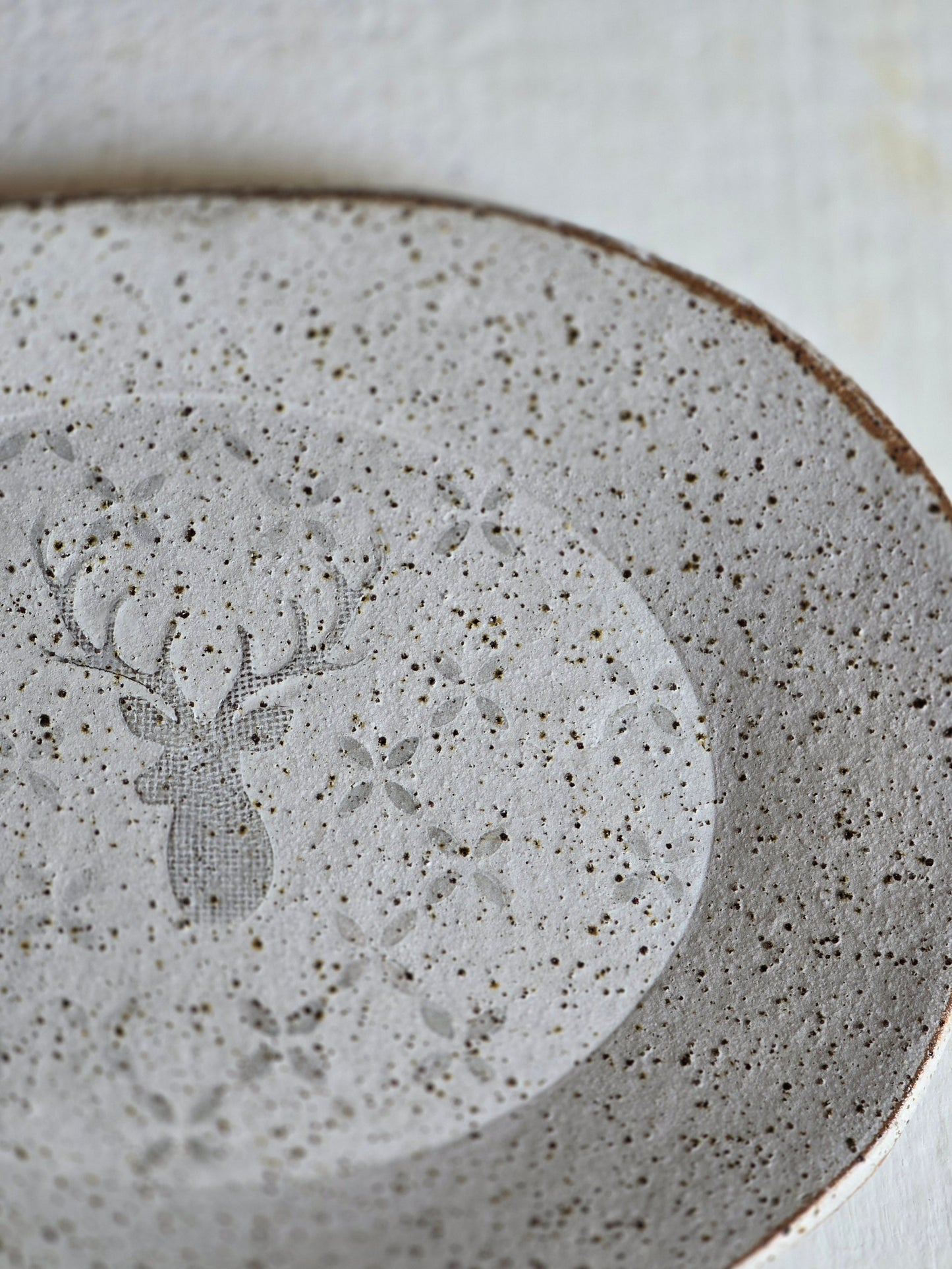 speckled white organic shaped deer serving dish