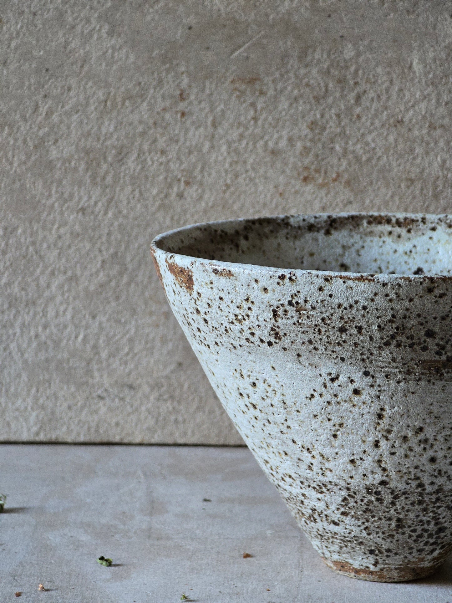 speckled white conical vessel/vase