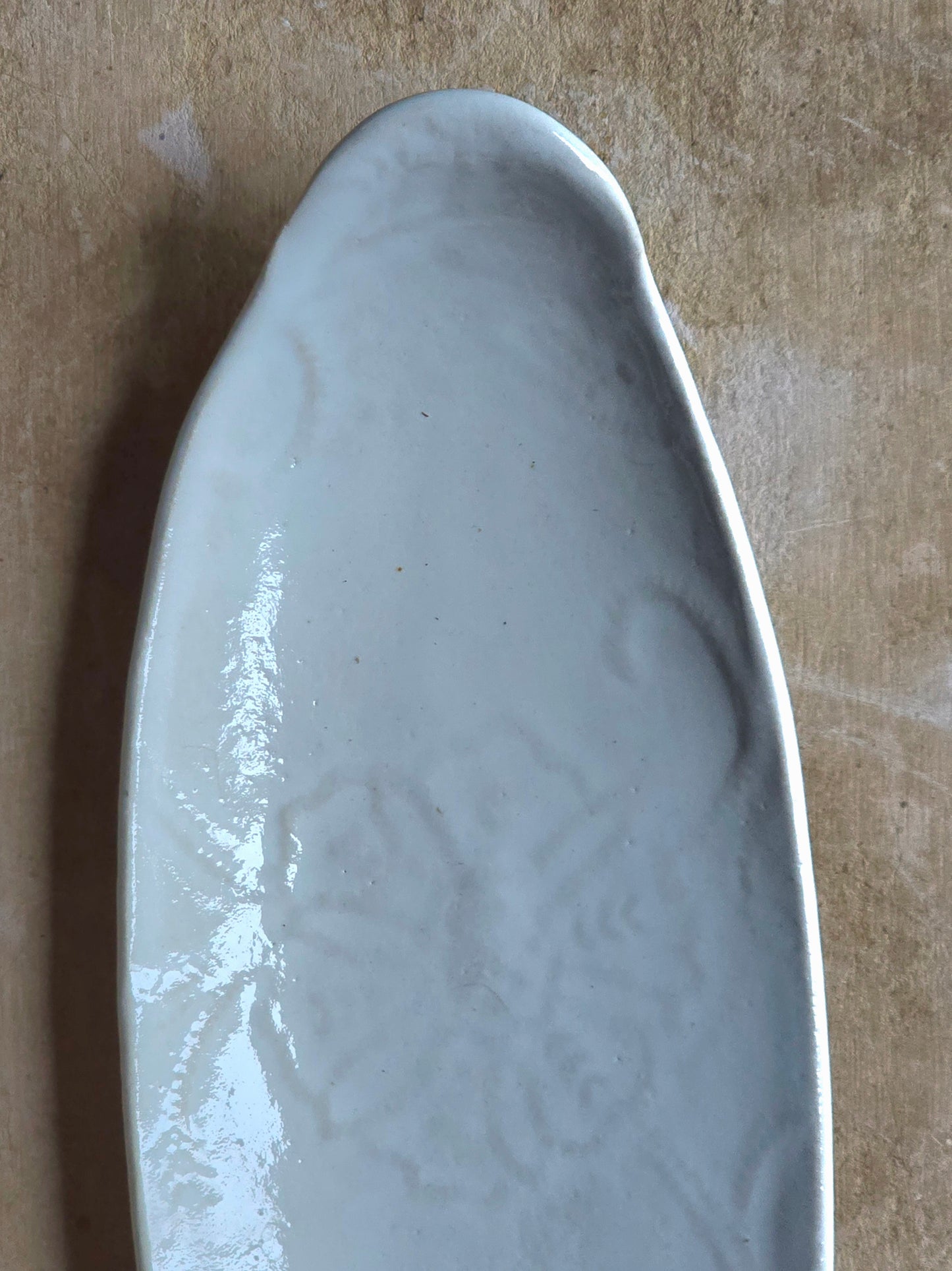 :
Handcrafted Boat-Shaped Floral Embossed Serving Platter | Glossy White Ceramic | Elegant Timeless Serveware